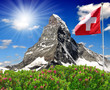 Beautiful mountain Matterhorn with Swiss flag - Swiss Alps