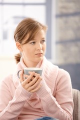 Wall Mural - Young woman drinking tea