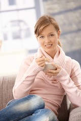 Wall Mural - Young woman eating cereals