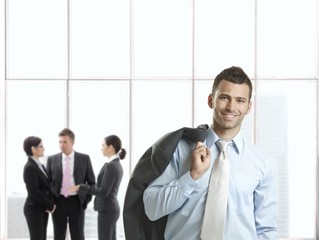 Wall Mural - Happy businessman in office lobby