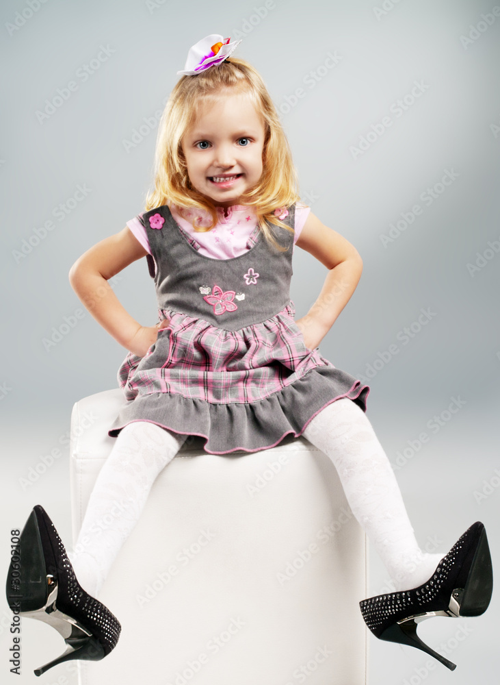little girl wore high heels Stock Photo | Adobe Stock