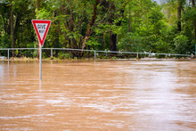 Very Flooded Road And Give Way Sign, Queensland, Australia