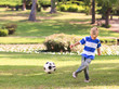 © WavebreakMediaMicro - Boy playing football in the park