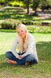 © WavebreakMediaMicro - Woman sitting in the park