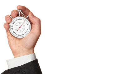 Man's hand holding stopwatch.