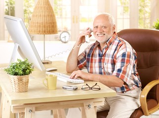 Canvas Print - Happy old man on landline call