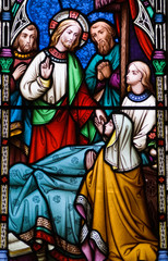 Jesus healing stained glass window