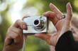 © logoboom - Senior woman hands holding compact photo camera