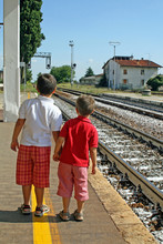 Two Brothers,children Waiting For The Train Station