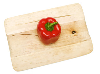 Poster - red paprika on wooden board