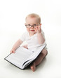 © blessings - Baby reading wearing glasses