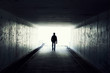 Silhouette of Man Walking in Tunnel. Light at End of Tunnel