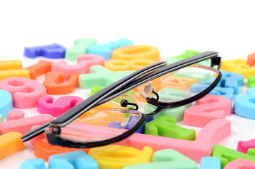 Eyeglasses and letters