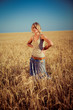 © Nastya Tepikina - Image of young woman on wheat field