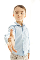 little boy greeting with his hand