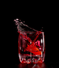 red martini cocktail splashing