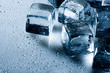 © Dmytro Tolokonov - Ice cube and water drops on the wet background