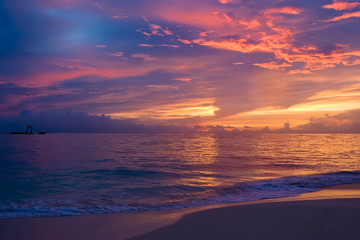 Wall Mural - Yellow red pink blue sunset on the ocean