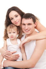 Happy mother, father and daughter playing on the white backgroun