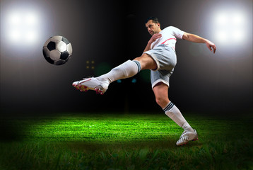 Wall Mural - Happiness football player after goal on the field of stadium wit