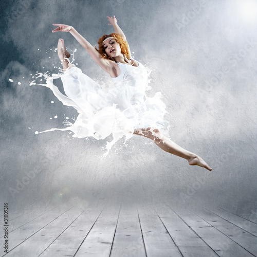 Fototapeta na wymiar Jump of ballerina with dress of milk