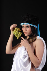 Ancient greece woman with a bunch of grapes