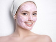 Smiling woman with facial mask