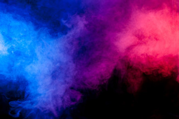 Wall Mural - Red and blue smoke on black background