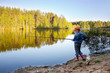 © Sergey Khamidulin - Girl on the lake fishing.