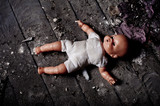Fototapeta  - doll on dirty ground