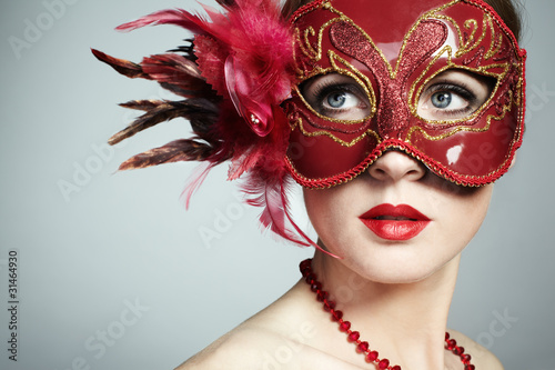 Fotografie, Obraz The beautiful young woman in a red mysterious venetian mask