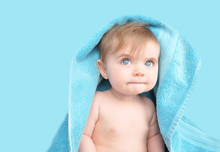 Cute Baby Under Blue Towel