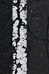 Asphalt road line closeup.