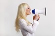 young blond woman with a megaphone (white background)
