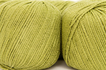 Wall Mural - the green yarn skeins isolated on white