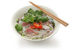 Pho bo , Vietnamese rice noodle soup with sliced rare beef