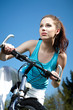 © ZoomTeam - Attractive brunette woman with bike