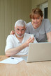 © goodluz - Senior couple checking medical information on internet