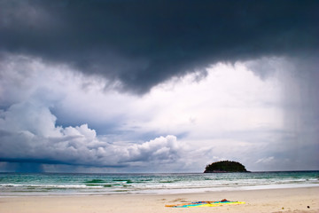 beautiful tropical beach under gloomy sky.