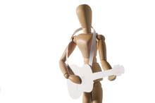 Wooden Mannequin Playing The Guitar From The Paper