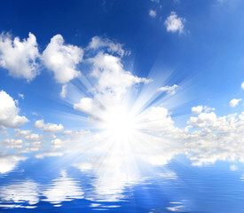 Wall Mural - water surface with sunshine and clouds