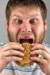 © Nomad_Soul - Man eating hamburger