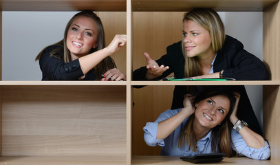 Three happy woman in office