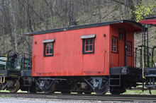 Red Caboose On A Train Track