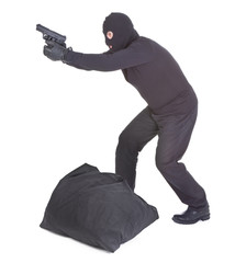 robber aiming with his gun