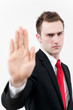 © taka - young businessman showing stop gesture