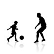 father and son play soccer
