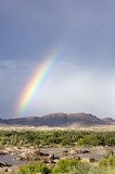 Fototapeta Tęcza - Rainbow over a river valley in South Africa