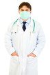 © Alliance - Medical doctor with mask on face holding hands in pockets