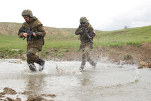 Soldiers Running Across The Water